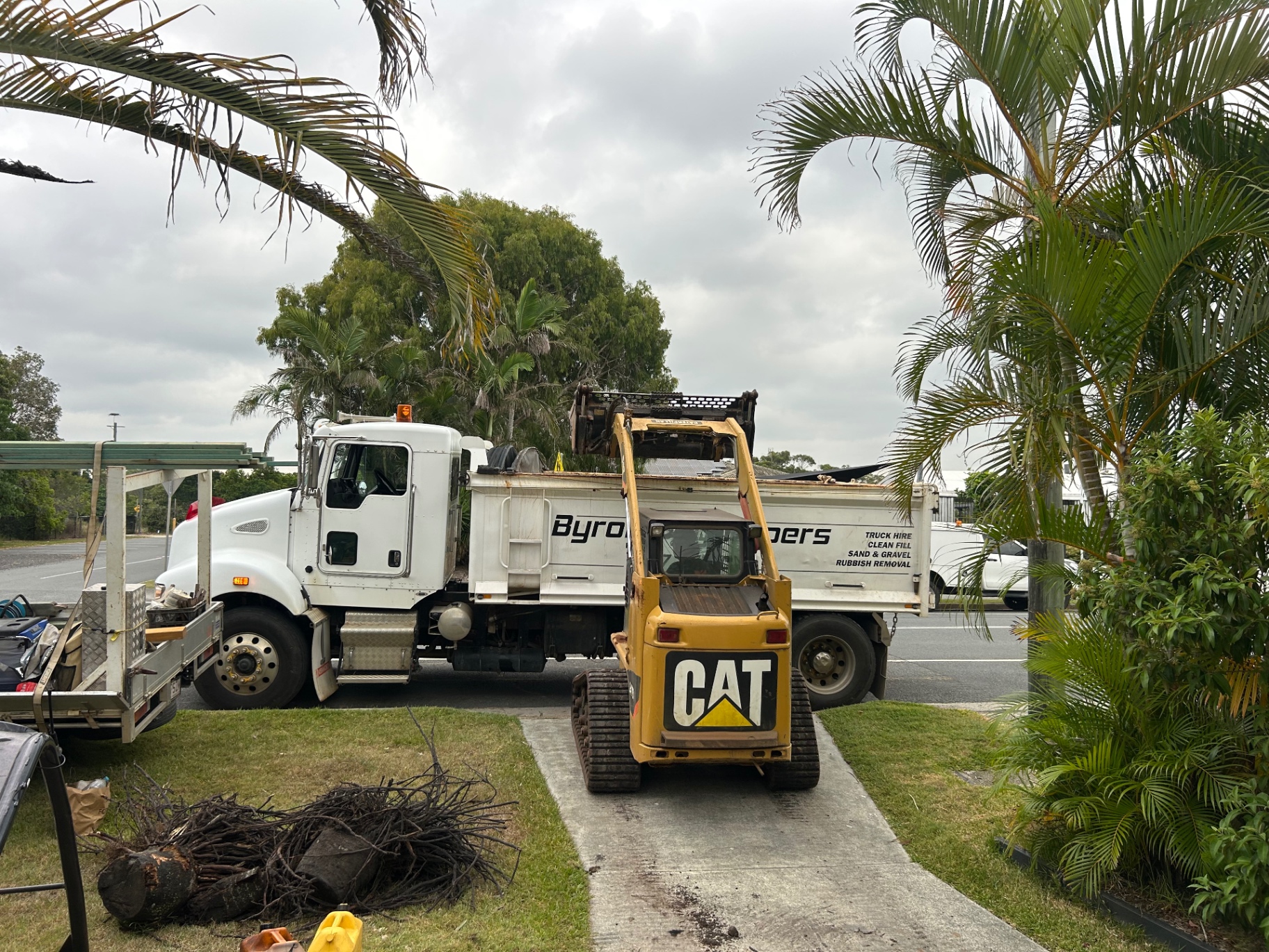 Byron Bay Tippers truck and CAT machine set up for a driveway job